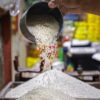 Tumpukan Karung Beras Bermerek di Gudang Oplosan